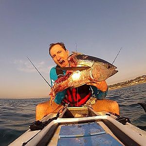 Kayak fishing - fight for a tuna with a shark