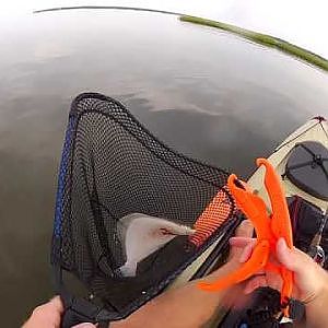 Kayak fishing catching a flounder near graveline bayou